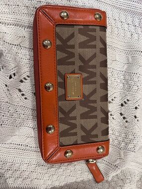 Michael Kors Delancy Tan  Leather & Canvas Wallet with  gold accents.